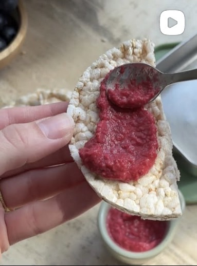 Rice cake topped with homemade berry chia jam